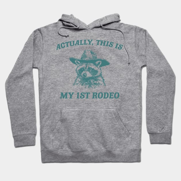 Raccoon Actually This Is My First Rodeo Shirt, Funny Trash Panda Meme Hoodie by CamavIngora